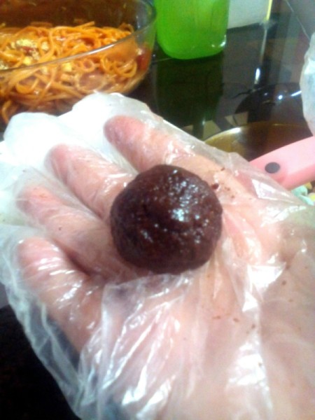Mallow Filled Choco Graham Ball in hand in hand