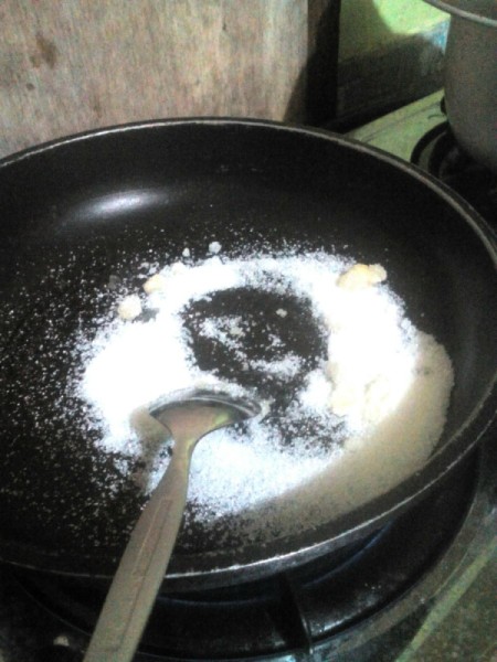 adding sugar and butter to pan