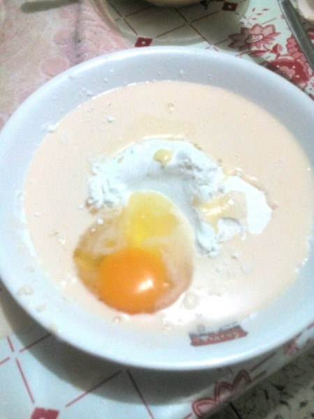 adding egg to batter