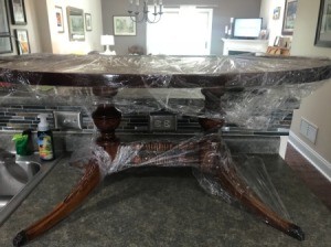 Value of a Mersman Coffee Table - plastic wrapped oval coffee table