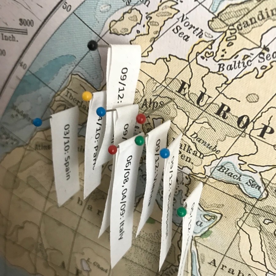 travel map with pins and string