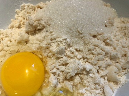 adding egg & sugar to dough