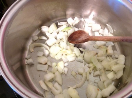 cooking chopped onion in pan