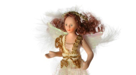 Angel doll with feather wings.