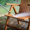 Pressure washing outdoor wooden chair.