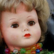 Face of an old porcelain doll.