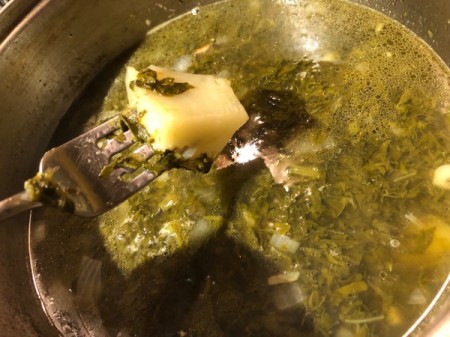 testing potato doneness with a fork