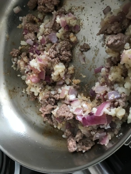adding meat back to pan