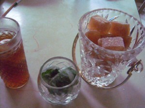 Cubes of frozen iced tea and spearmint.