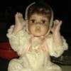 Identifying a Porcelain Doll - baby doll wearing a one piece outfit