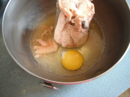 egg added to salmon in bowl