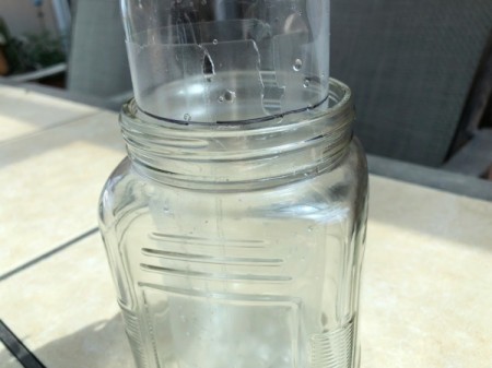 Popcorn Kernel Jar Secret Safe - stick the water bottle into the jar and draw a line at the lip of the jar