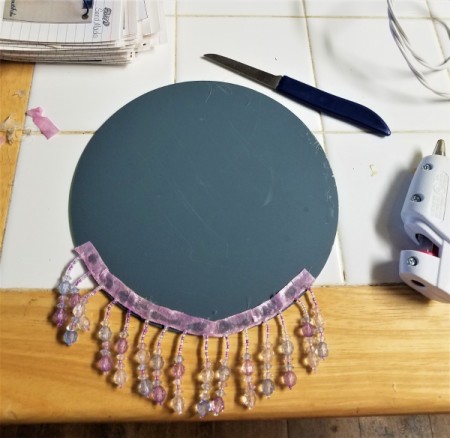 BeJeweled' Mirror - notch and glue the ribbon fringe onto the back of the mirror