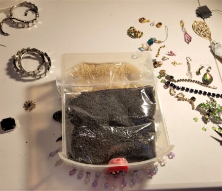 BeJeweled' Mirror - small plastic drawer filled with sand weighing down glued on gems