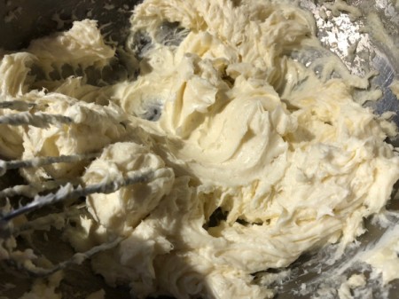 adding sugar to whipped cream cheese