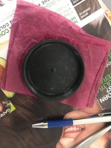 Tissue Paper Flower Bow - using a lid to trace a circle on a stack of dark reddish pink paper