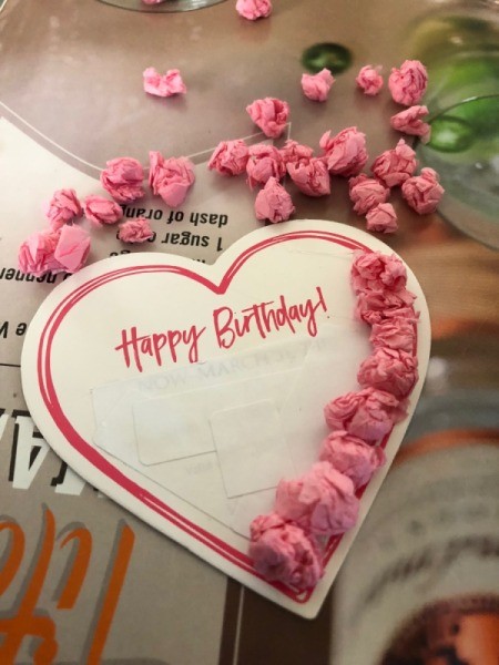 Upcycled Coupon to Birthday Card - hot glue the tissue balls on the heart