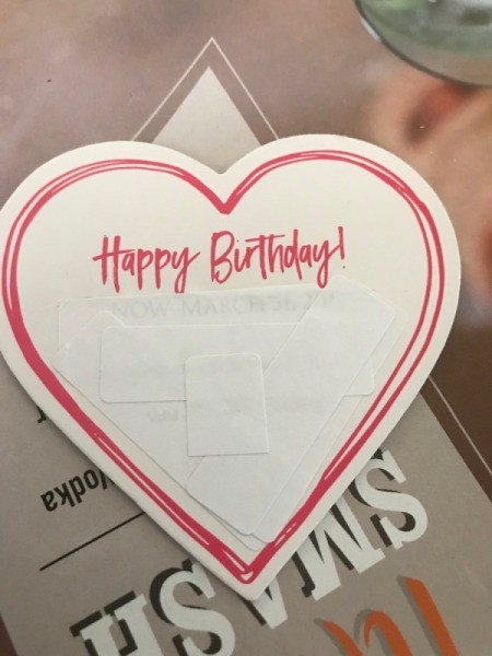Upcycled Coupon to Birthday Card - information below the greeting covered with white stickers