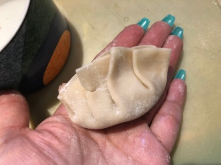 pinching potsticker closed