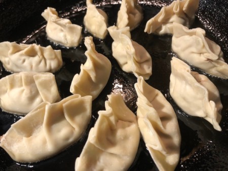 potstickers cooking in oil