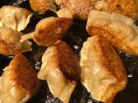 browned Potstickers steaming