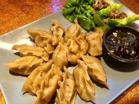 Potstickers on plate with dipping sauce