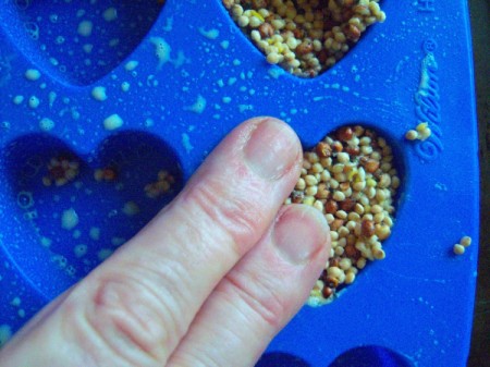 Bird Seed Heart Wedding Favors - pressing down with oiled fingers