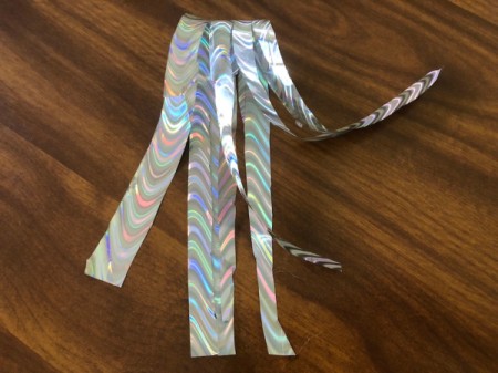 Tin Can Unicorn Planter - fold it in half and cut thin strips to within 1/2 inch of the fold