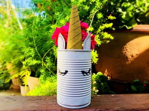 Tin Can Unicorn Planter - flower filled can outside