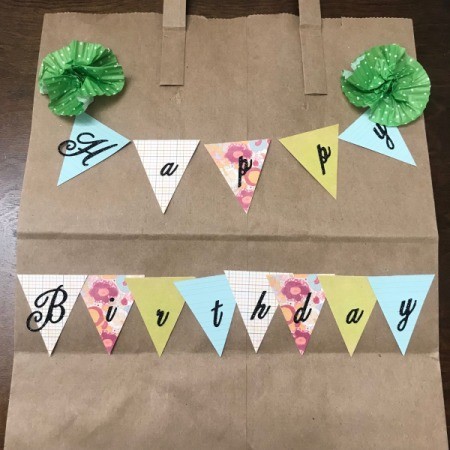 Happy Birthday Gift Bag - bag with liners taped on both sides at the top and Happy Birthday Banner in place prior to gluing