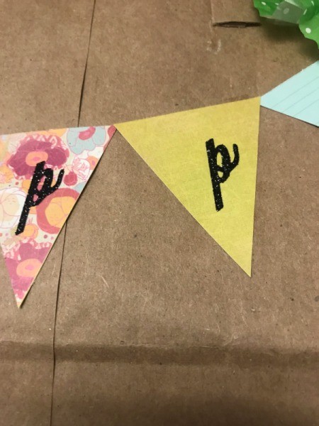 Happy Birthday Gift Bag - closeup of banner parts being placed for "Happy"