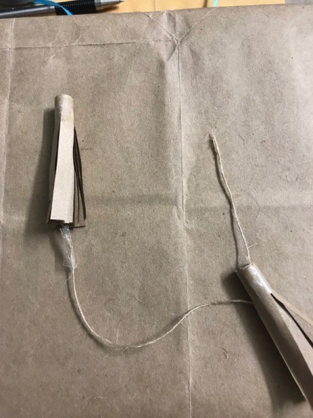 Simple Tassel Bow Gift Topper - wrap a bit of tape around the end of a piece of twine