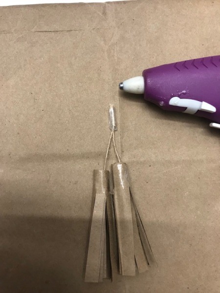 Simple Tassel Bow Gift Topper - hot gluing tassels in place