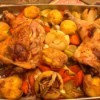 finished Herbed Chicken Quarters with Smashed Potatoes on platter