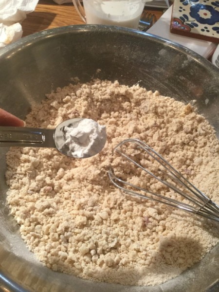 adding baking powder to dough