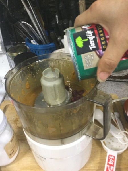 adding beans to processor