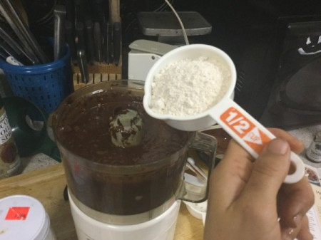 adding flour tp processor