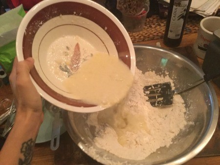 adding liquid to flour