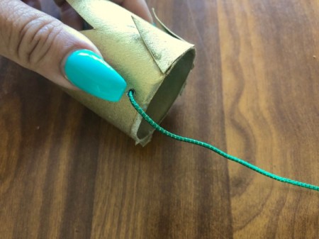 Cardboard Tube Crowns - string elastic through the holes and knot on the inside