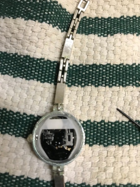 Replacing Your Watch Battery - opened watch with plastic battery cover still in place