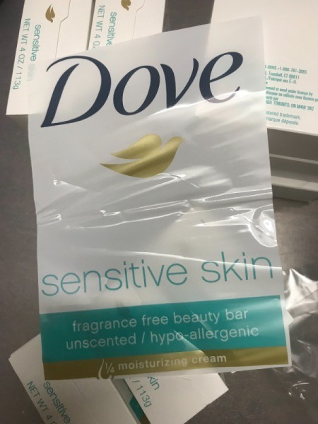 A plastic wrapper from a package of Dove bar soap.