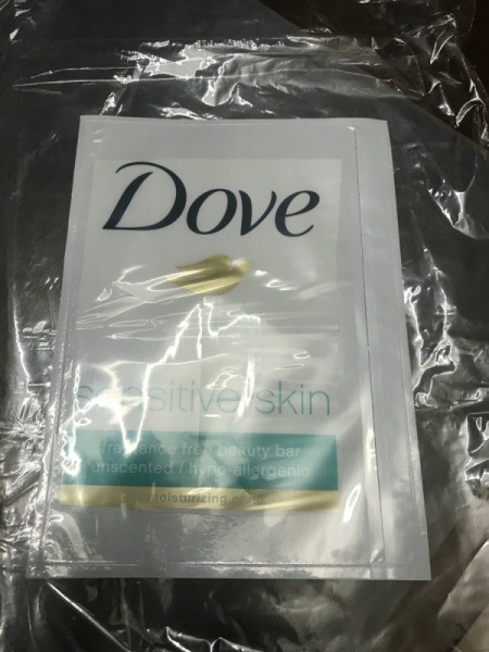 A plastic wrapper from a package of Dove bar soap inside a plastic bag.