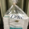 A plastic wrapper from a package of Dove bar soap inside a plastic bag.