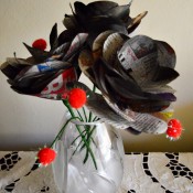 Bunch of Newspaper Roses - vase filled with roses and pom poms