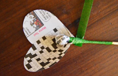 Bunch of Newspaper Roses - fold pointed end around the skewer and wrap with floral tape