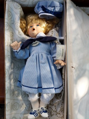 Information on a Wimbledon
 Collection Betsy Doll - doll wearing a blue dress with saddle shoes