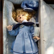 Information on a Wimbledon
 Collection Betsy Doll - doll wearing a blue dress with saddle shoes