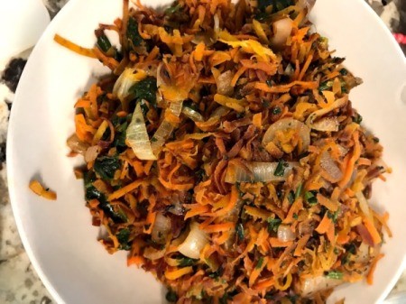 mixing vegetables with noodles