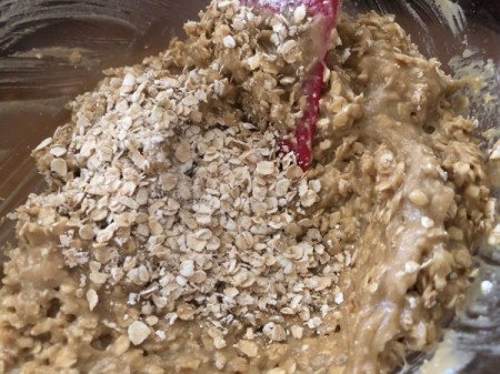 adding oats to batter