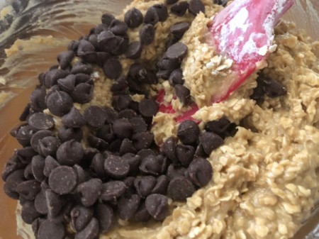 adding chocolate chips to batter